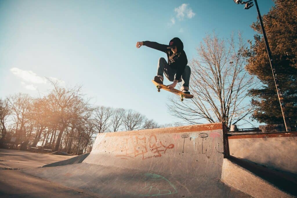 A young adult male on his skateboard in a skate park