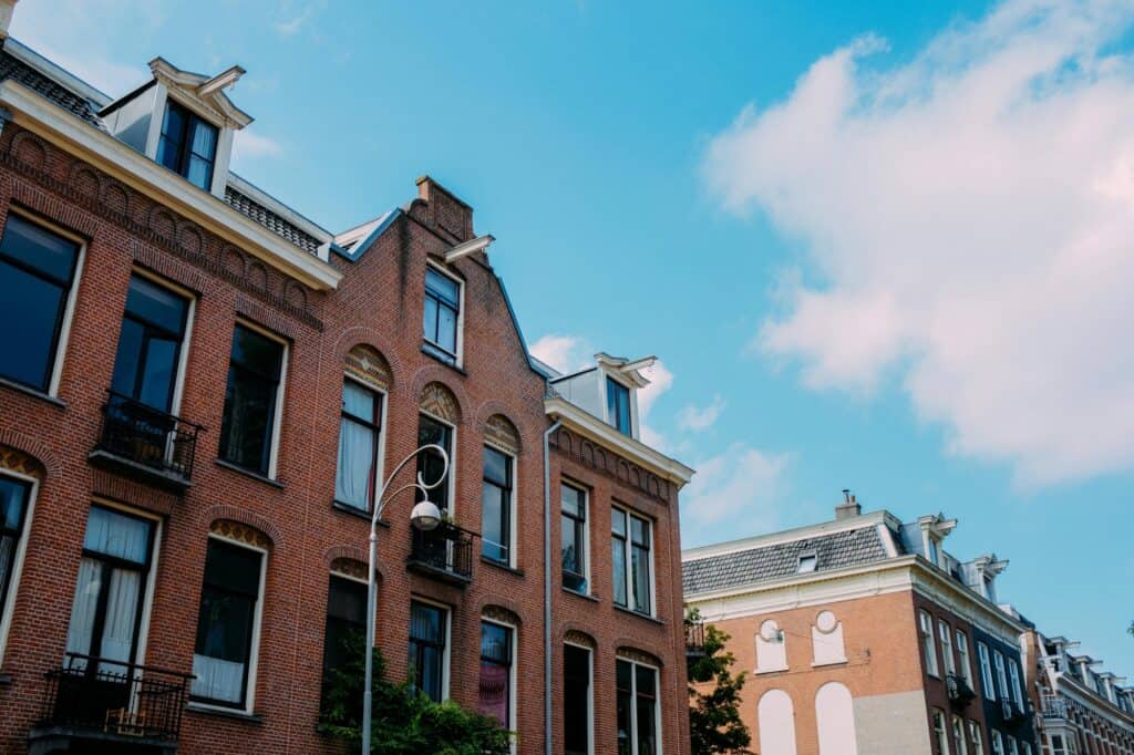 A huge brick house beside another large brick house